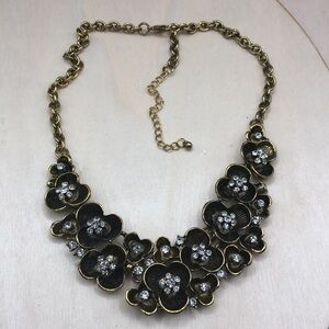 Antiqued brass flower bib necklace-statement style.